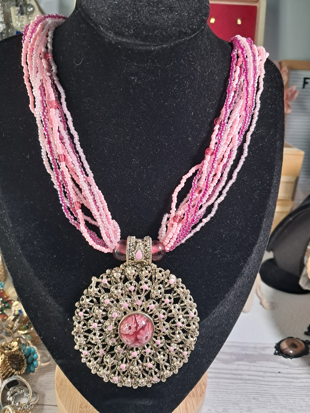 Handcrafted Pink Multi-Strand Beaded Necklace with Ornate Pendant